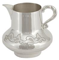 Серебряный молочник